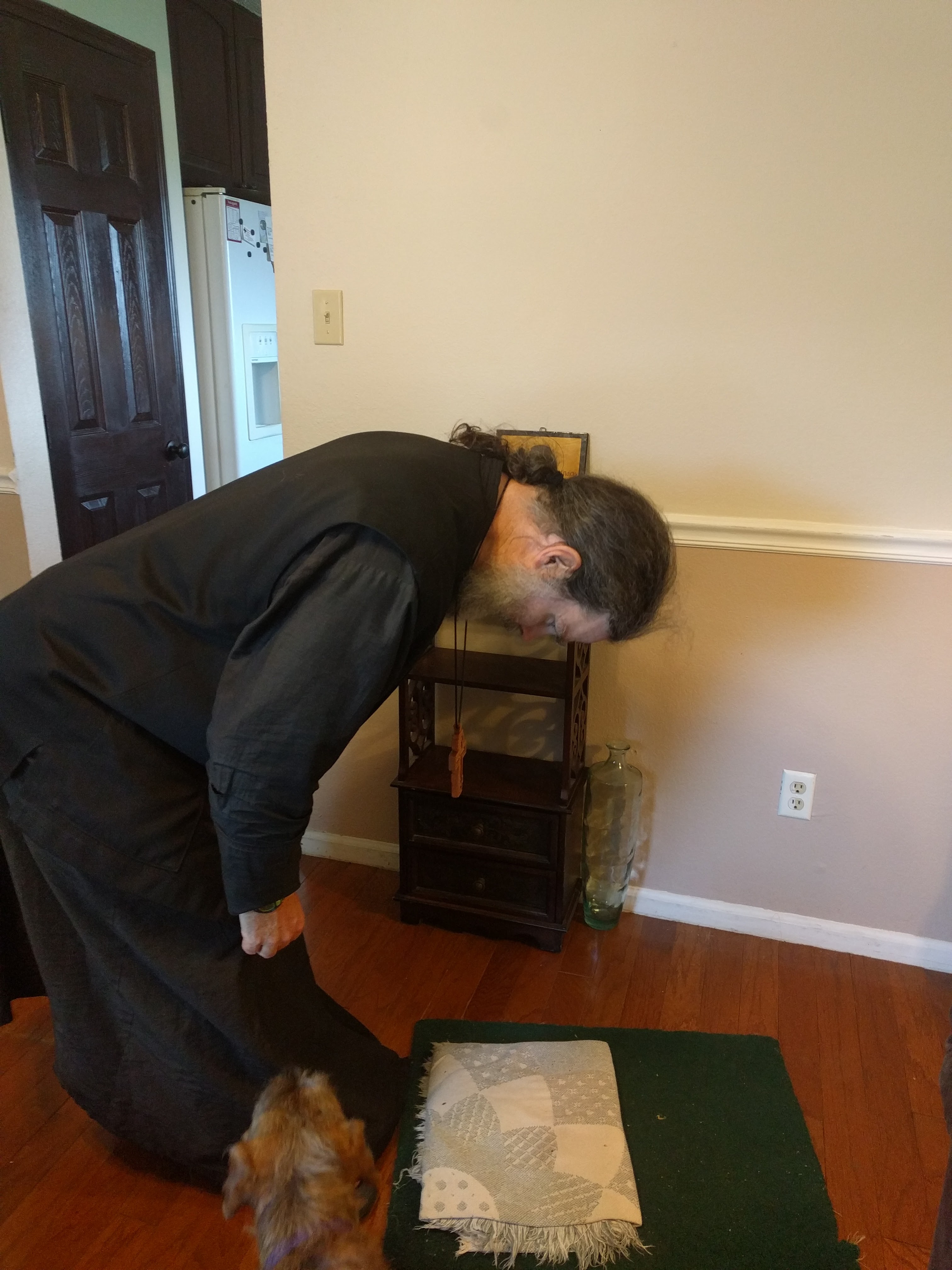 A low bow, or poklon. https://www.orthodox.net//images/low-bow-poklon.jpg